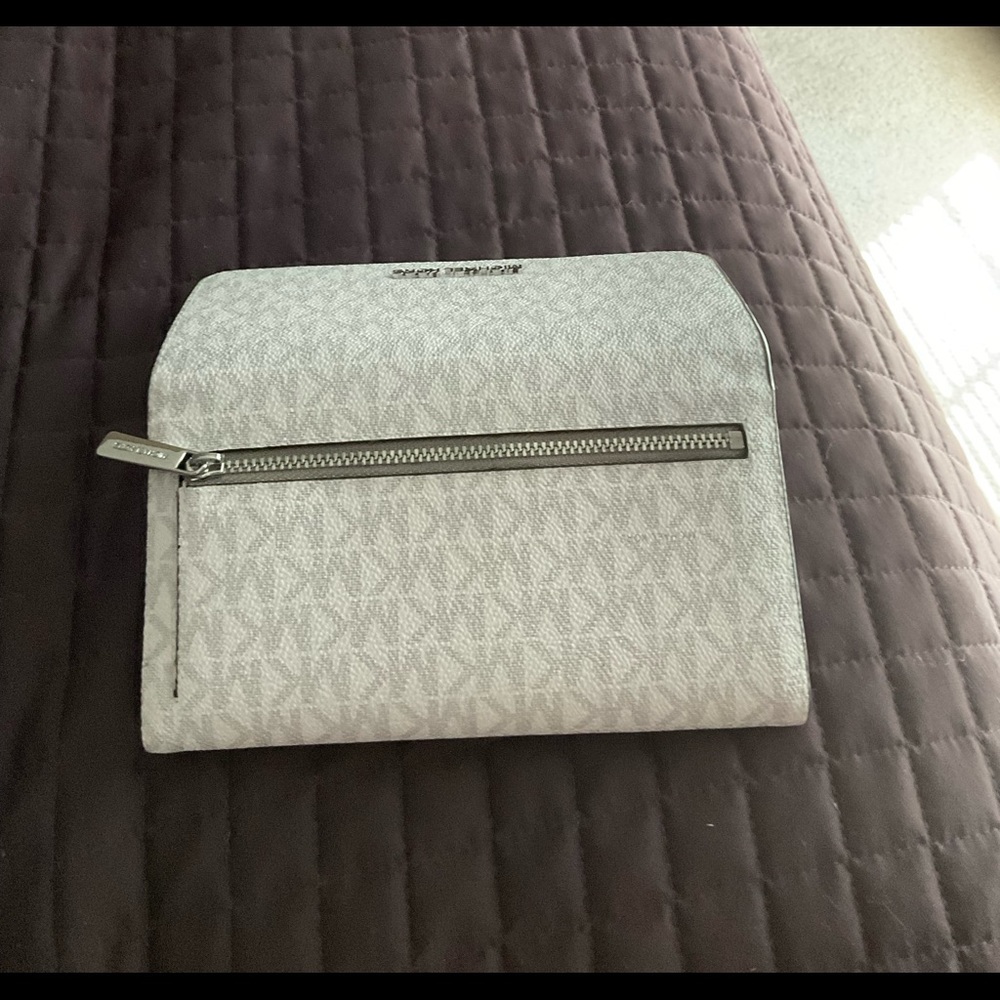 White and gray Michael Kors wallet